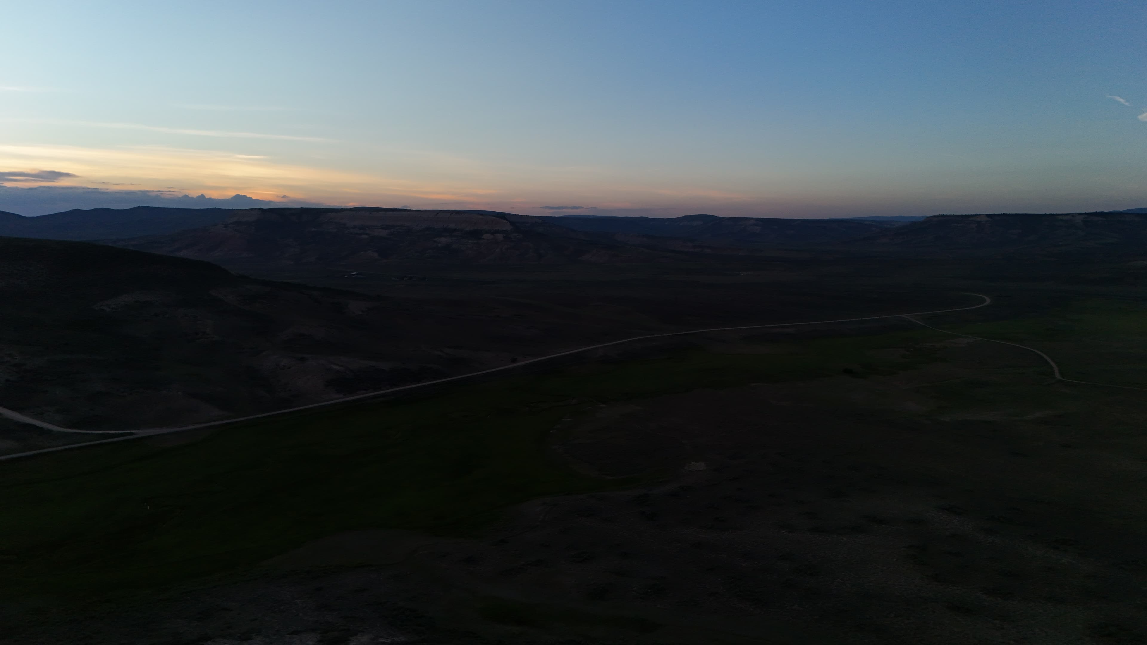 Hills and sky at twilight over a Wyoming landscape.