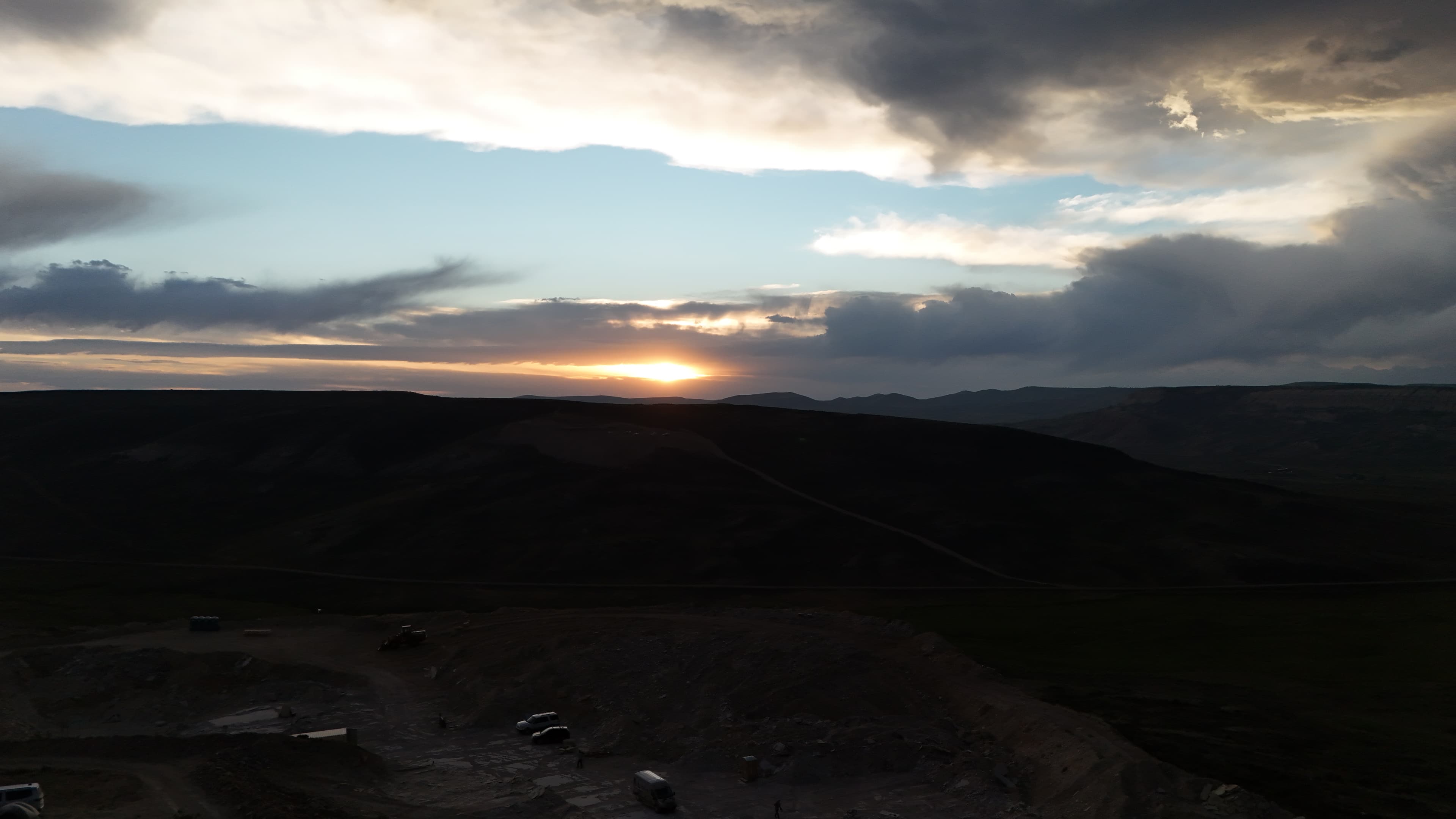 Sun setting over the Wyoming hills above the dig site.