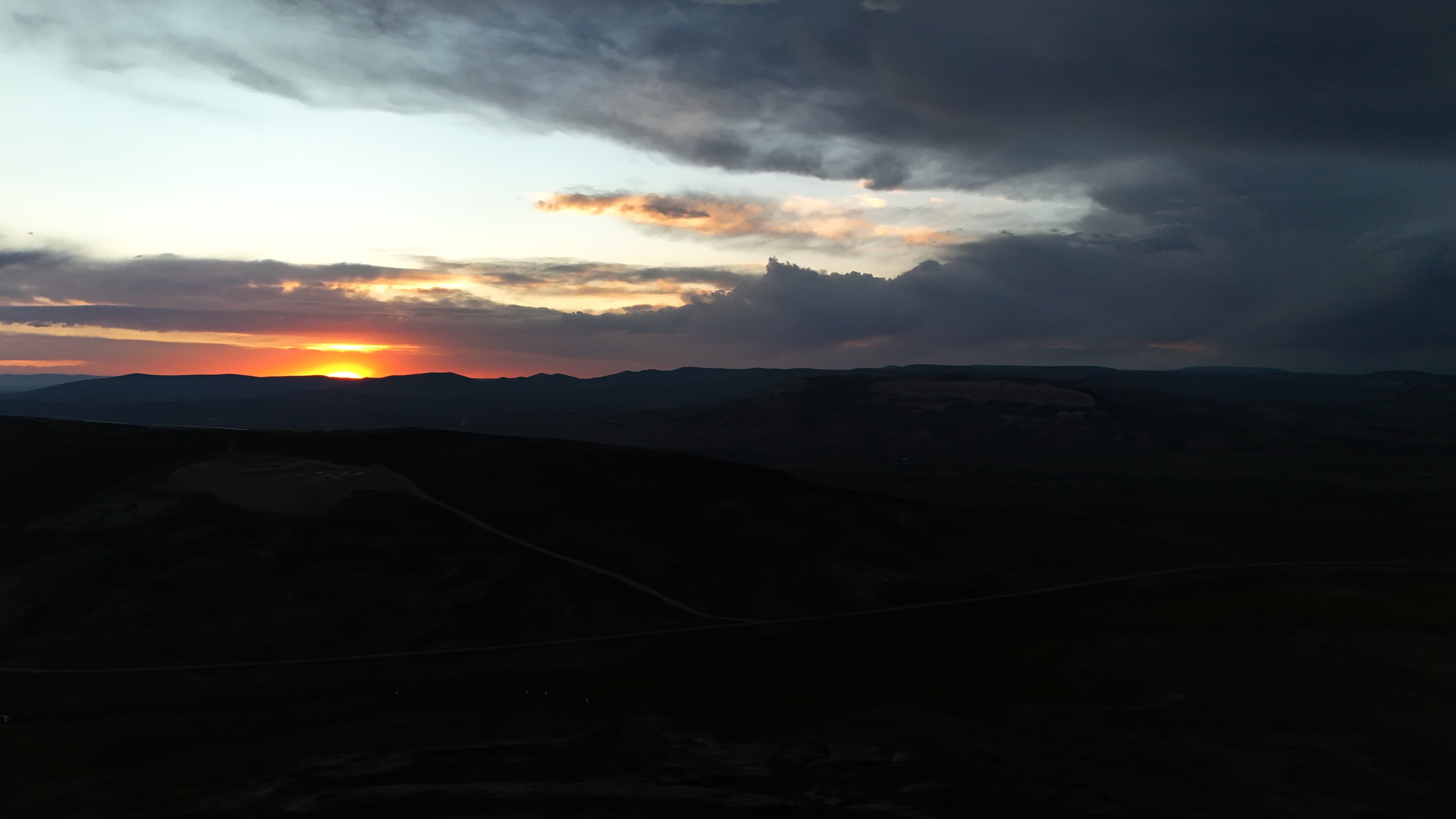 Sunset over the hills near the dig site.